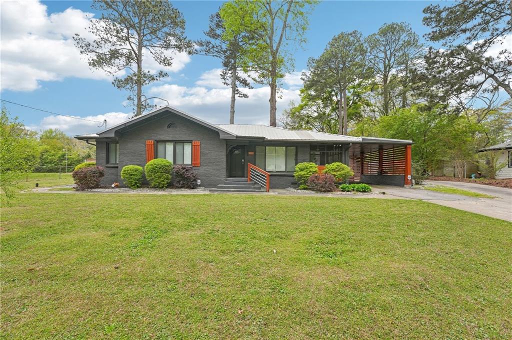 2659 Glenvalley Drive Decatur, GA 30032 - Photo 1 of 59 a front view of house with yard and green space