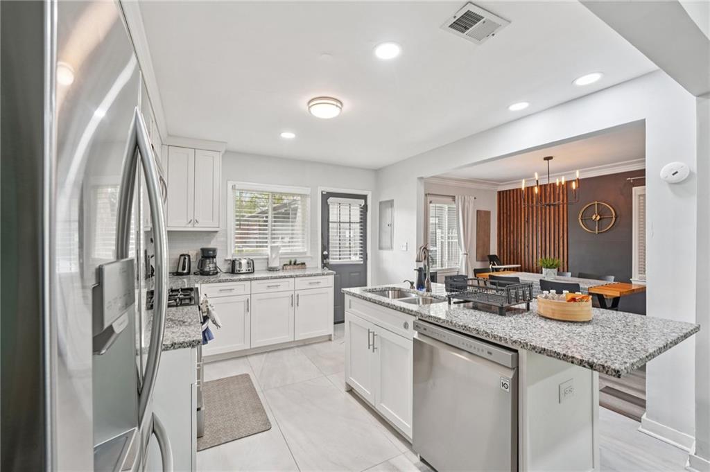 2659 Glenvalley Drive Decatur, GA 30032 - Photo 19 of 59 a kitchen with a sink stove and cabinets