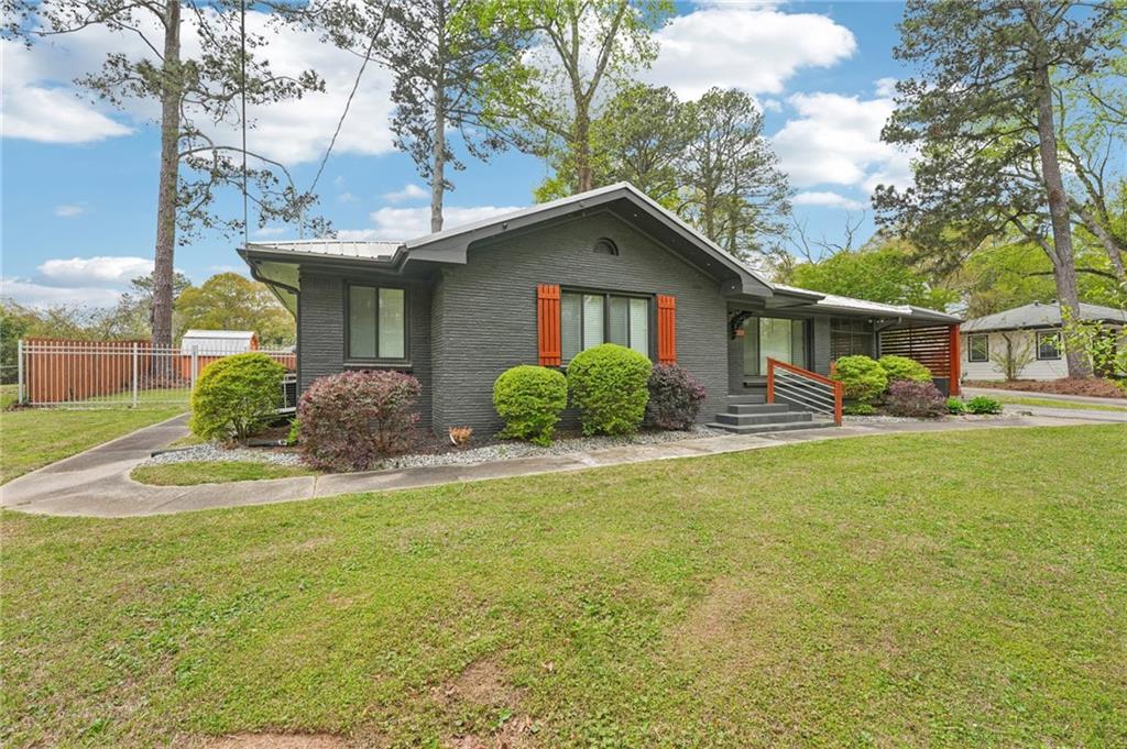 2659 Glenvalley Drive Decatur, GA 30032 - Photo 2 of 59 a front view of house with yard and trees around