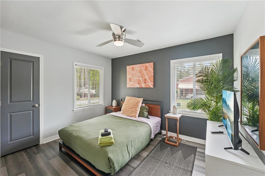 2659 Glenvalley Drive Decatur, GA 30032 - Photo 21 of 59 a bedroom with a large bed and a flat tv screen on dresser