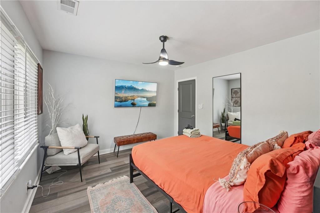 2659 Glenvalley Drive Decatur, GA 30032 - Photo 24 of 59 a bedroom with a bed and a chandelier