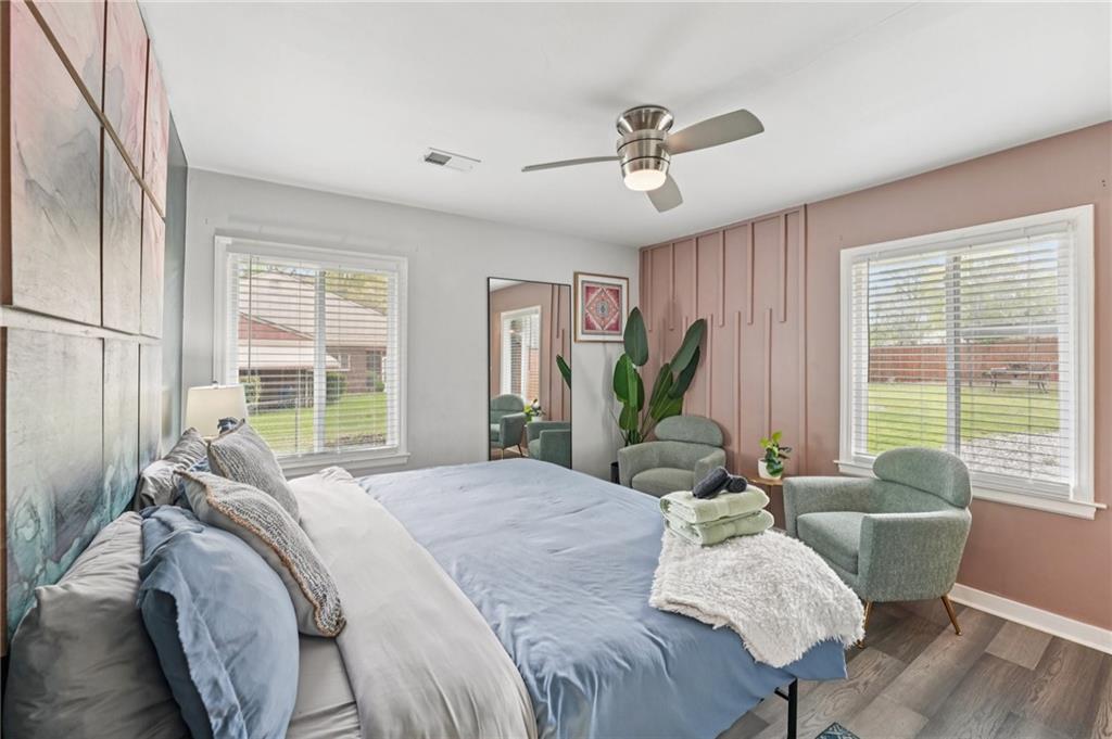 2659 Glenvalley Drive Decatur, GA 30032 - Photo 25 of 59 a spacious bedroom with a bed and glass windows