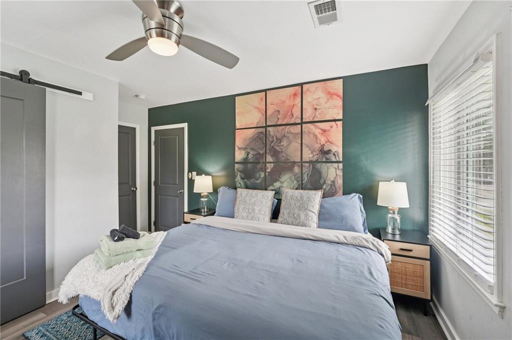 2659 Glenvalley Drive Decatur, GA 30032 - Photo 27 of 59 a bedroom with a large bed and a window