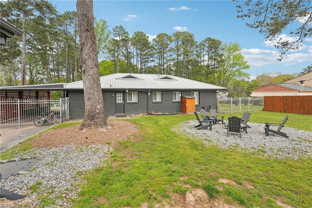 2659 Glenvalley Drive Decatur, GA 30032 - Photo 34 of 59 a front view of a house with yard patio and outdoor seating