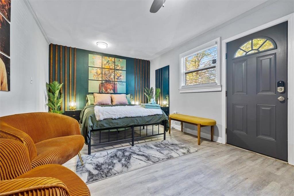 2659 Glenvalley Drive Decatur, GA 30032 - Photo 44 of 59 a bedroom with a bed and wooden floor