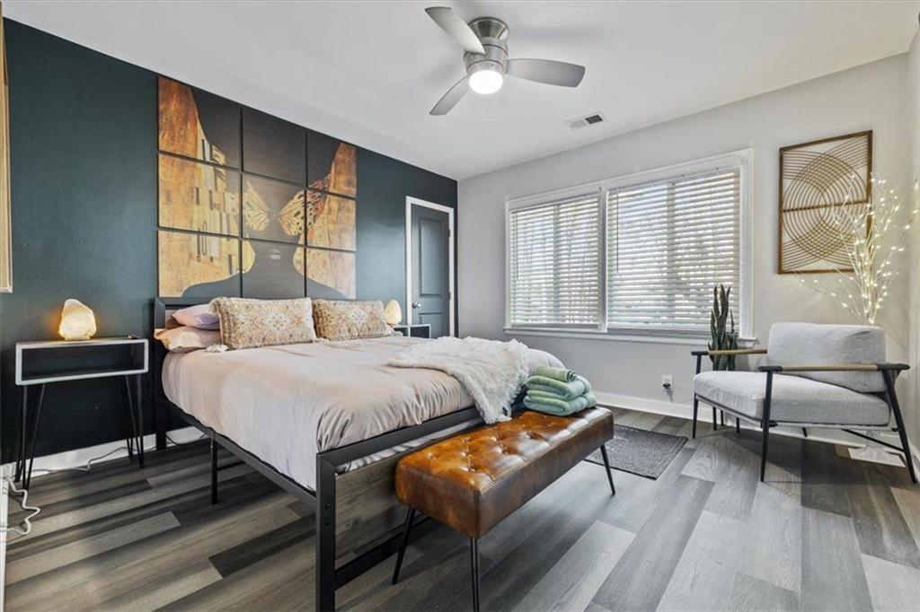 2659 Glenvalley Drive Decatur, GA 30032 - Photo 47 of 59 a bedroom with a bed and wooden floor