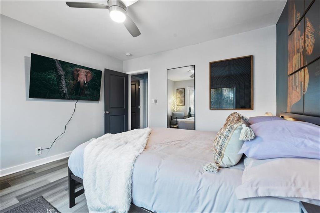 2659 Glenvalley Drive Decatur, GA 30032 - Photo 48 of 59 a bedroom with a bed and a flat screen tv