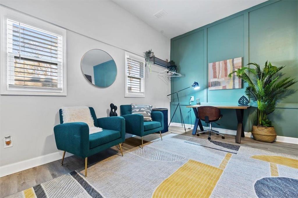 2659 Glenvalley Drive Decatur, GA 30032 - Photo 50 of 59 a living room with furniture a rug and a potted plant