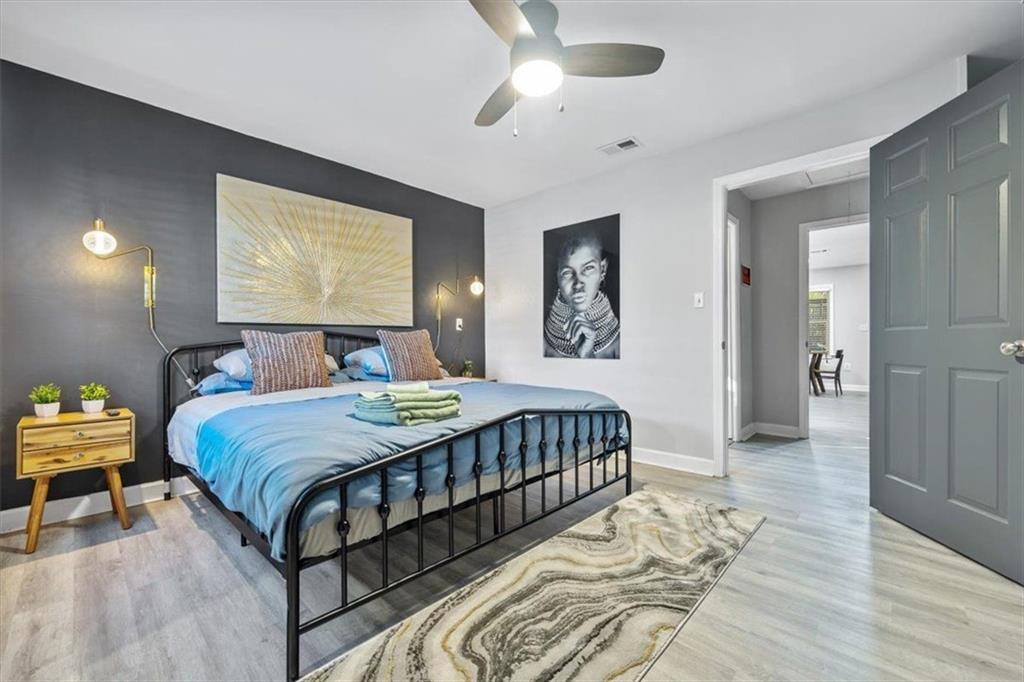 2659 Glenvalley Drive Decatur, GA 30032 - Photo 52 of 59 a bedroom with a bed and a chandelier