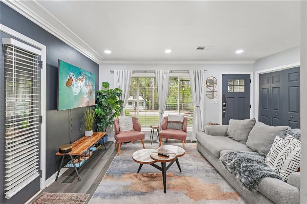 2659 Glenvalley Drive Decatur, GA 30032 - Photo 7 of 59 a living room with furniture a rug and a flat screen tv