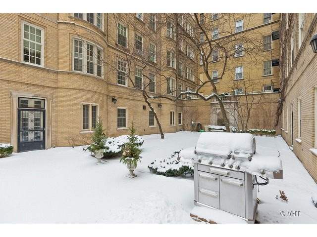 70 East Scott Street, Unit 408 Chicago, IL 60610 - Photo 9 of 9 a view of a terrace with chairs