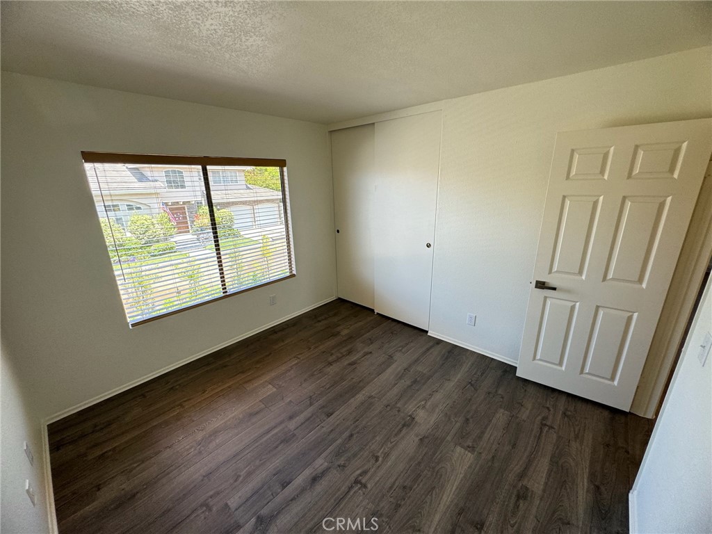 27515 Via Valor Dana Point, CA 92624 - Photo 14 of 24 a view of an empty room with wooden floor and a window