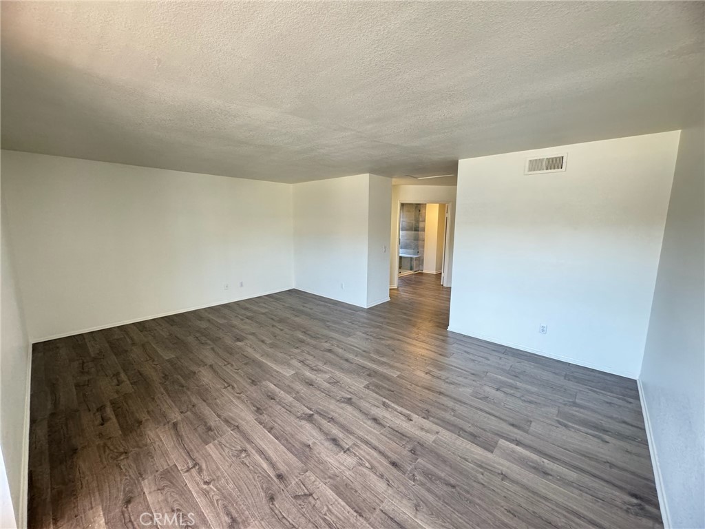 27515 Via Valor Dana Point, CA 92624 - Photo 16 of 24 a view of empty room with wooden floor