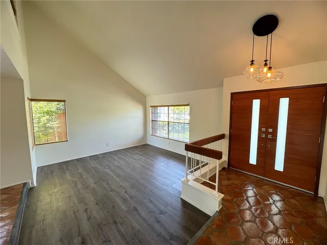 a room with wooden floor and window