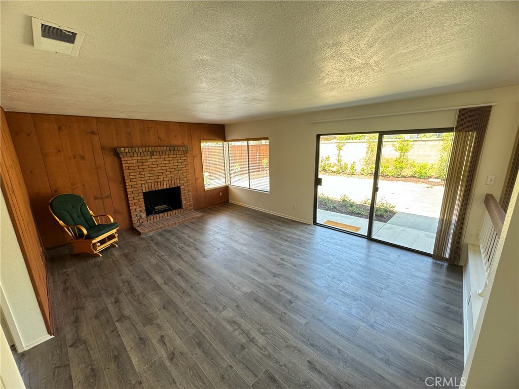 27515 Via Valor Dana Point, CA 92624 - Photo 8 of 24 a view of empty room with wooden floor and fireplace