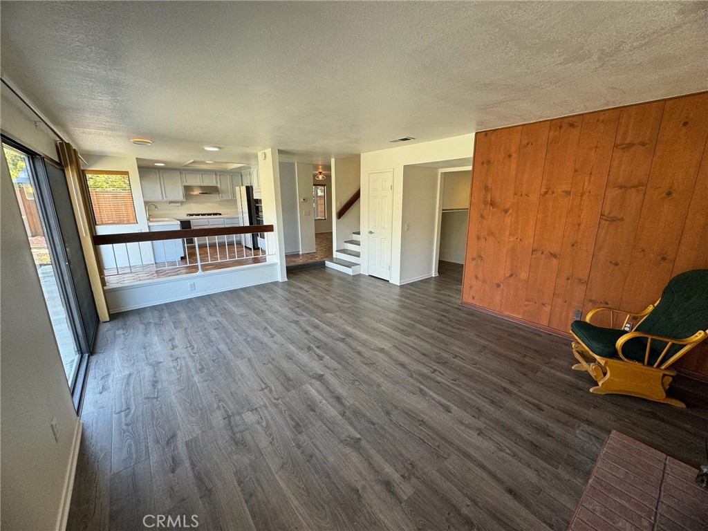 27515 Via Valor Dana Point, CA 92624 - Photo 9 of 24 a view of a room with wooden floor and windows