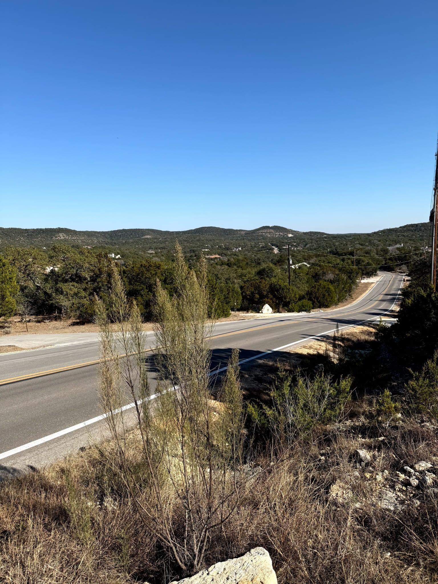 1392 Johnson Road Canyon Lake, TX 78133 - Photo 17 of 18 a view of a lake with a mountain in the background
