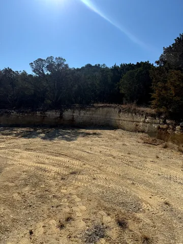 a view of swimming pool with a yard