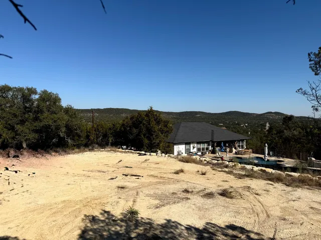 a view of pool with a yard