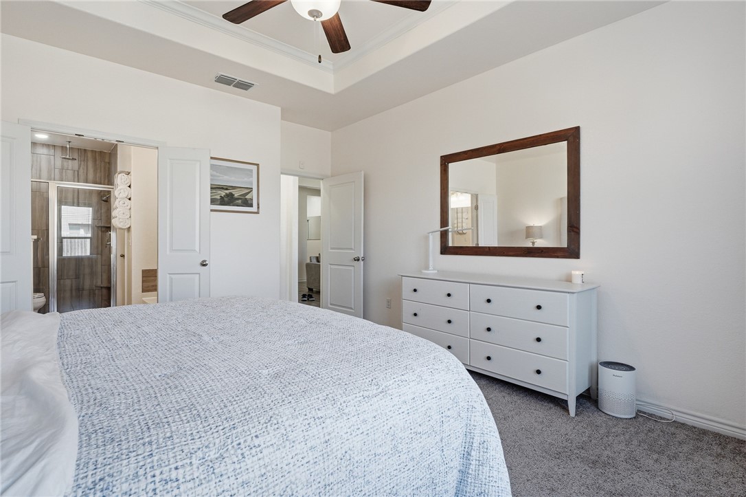 1026 Pasadena Street Portland, TX 78374 - Photo 19 of 30 a bedroom with a bed and a flat screen tv