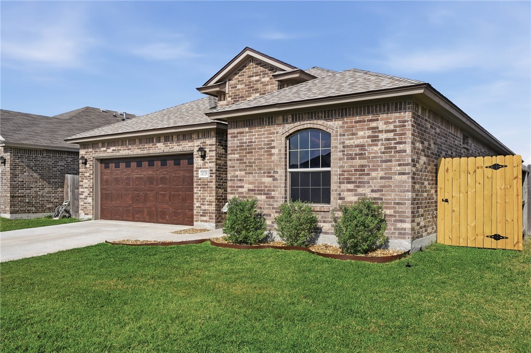 1026 Pasadena Street Portland, TX 78374 - Photo 2 of 30 front view of a house with a garden