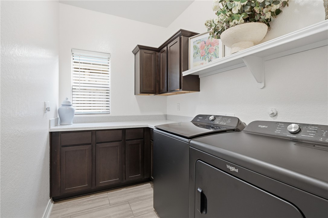 1026 Pasadena Street Portland, TX 78374 - Photo 24 of 30 a utility room with sink dryer and washer