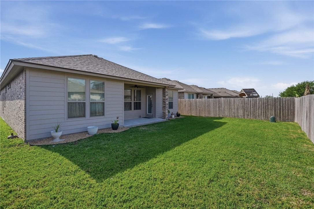 1026 Pasadena Street Portland, TX 78374 - Photo 29 of 30 a view of a house with a backyard