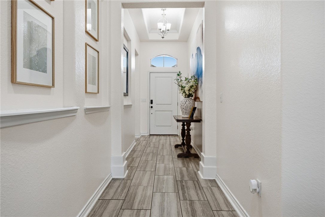 1026 Pasadena Street Portland, TX 78374 - Photo 4 of 30 a view of a hallway with wooden floor and staircase