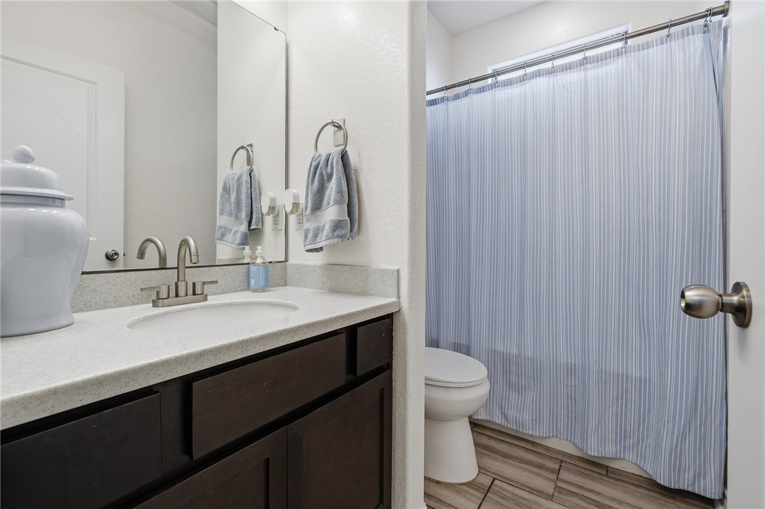 1026 Pasadena Street Portland, TX 78374 - Photo 7 of 30 a bathroom with a double vanity sink and a mirror