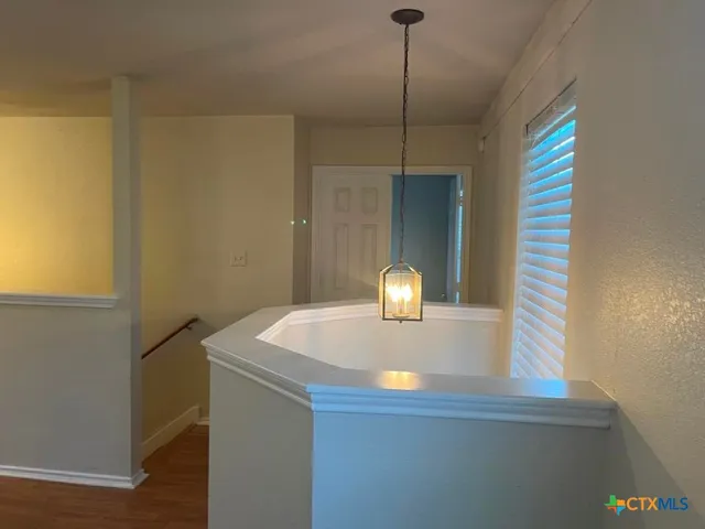 a kitchen with a sink and a window