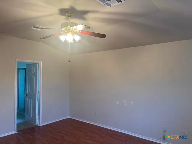 a view of a chandelier fan in a room