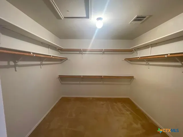 a view of a room with racks on the wall