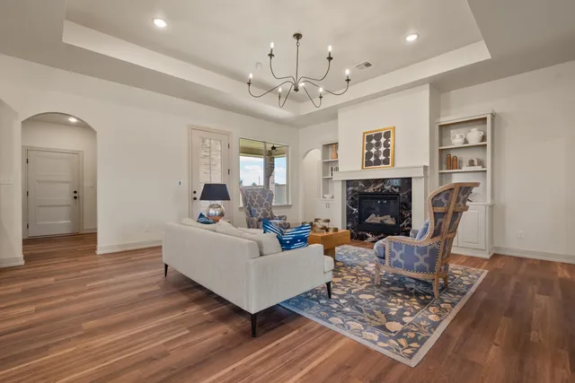 a living room with furniture and a fireplace