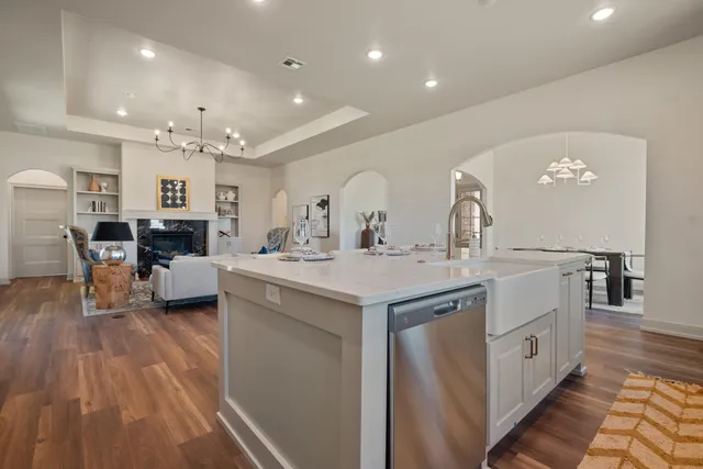 a kitchen with a sink and a stove top oven