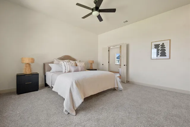 a bedroom with a bed and window