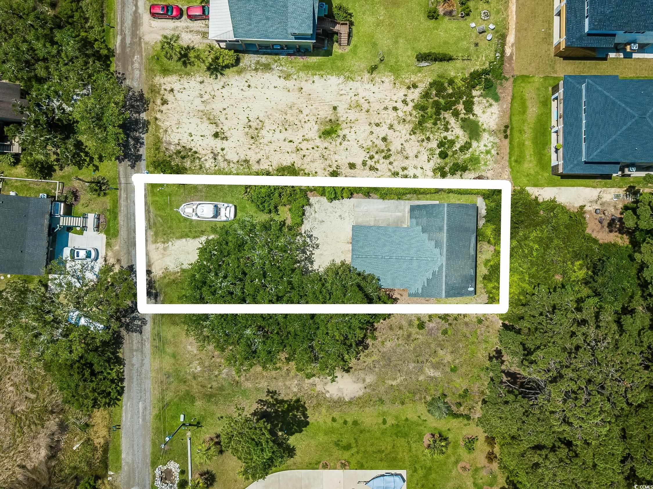 127 Brown Pelican Loop Pawleys Island, SC 29585 - Photo 26 of 31 Aerial view of property and surrounding area with property parcel outlined