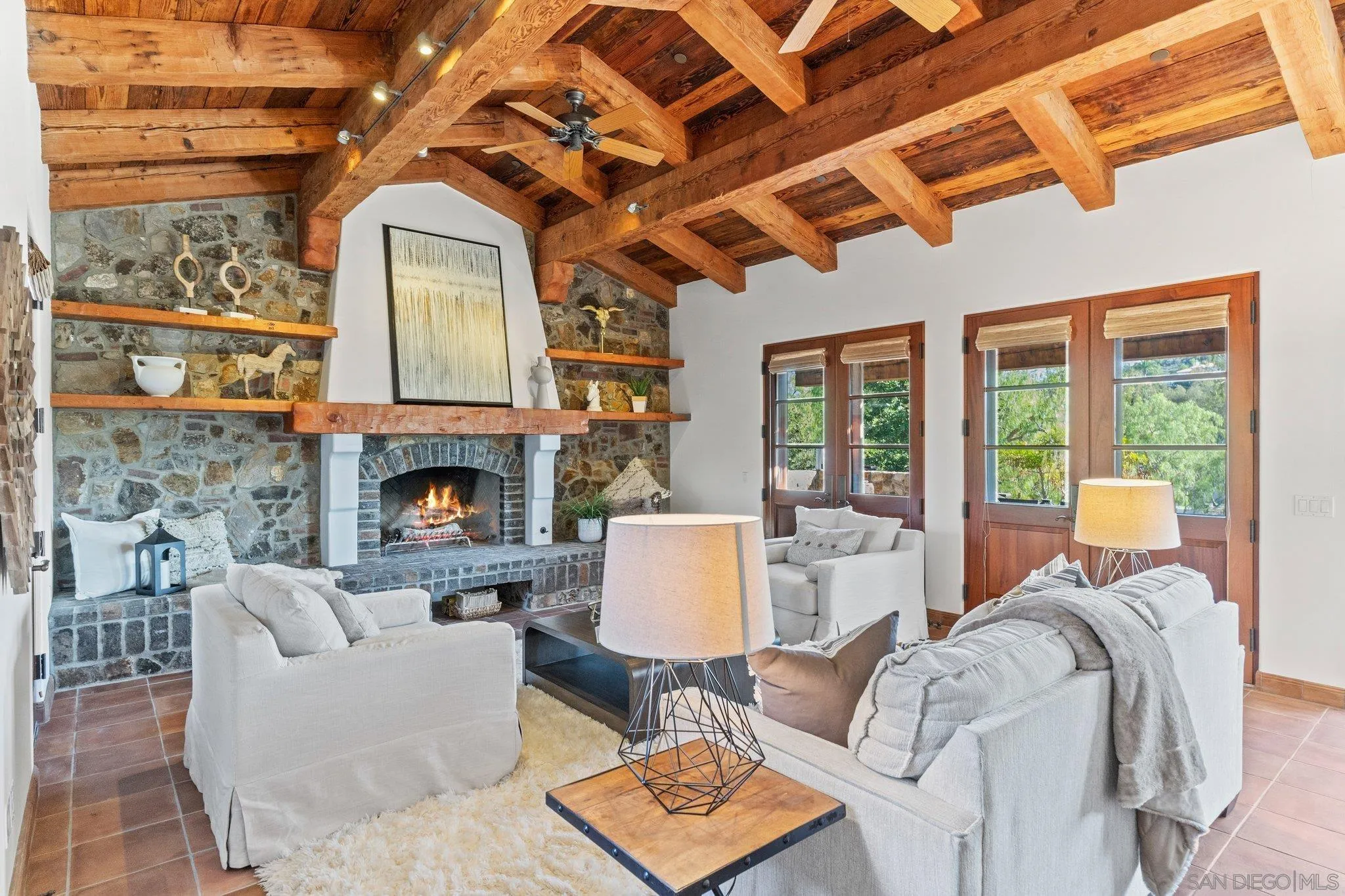 3113 Camino Del Rancho Encinitas, CA 92024 - Photo 11 of 40 a living room with furniture and a fireplace