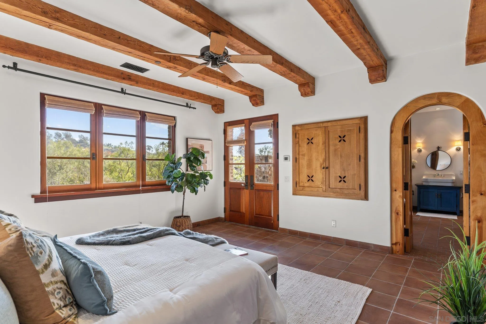 3113 Camino Del Rancho Encinitas, CA 92024 - Photo 13 of 40 a bedroom with a bed and dresser with mirror