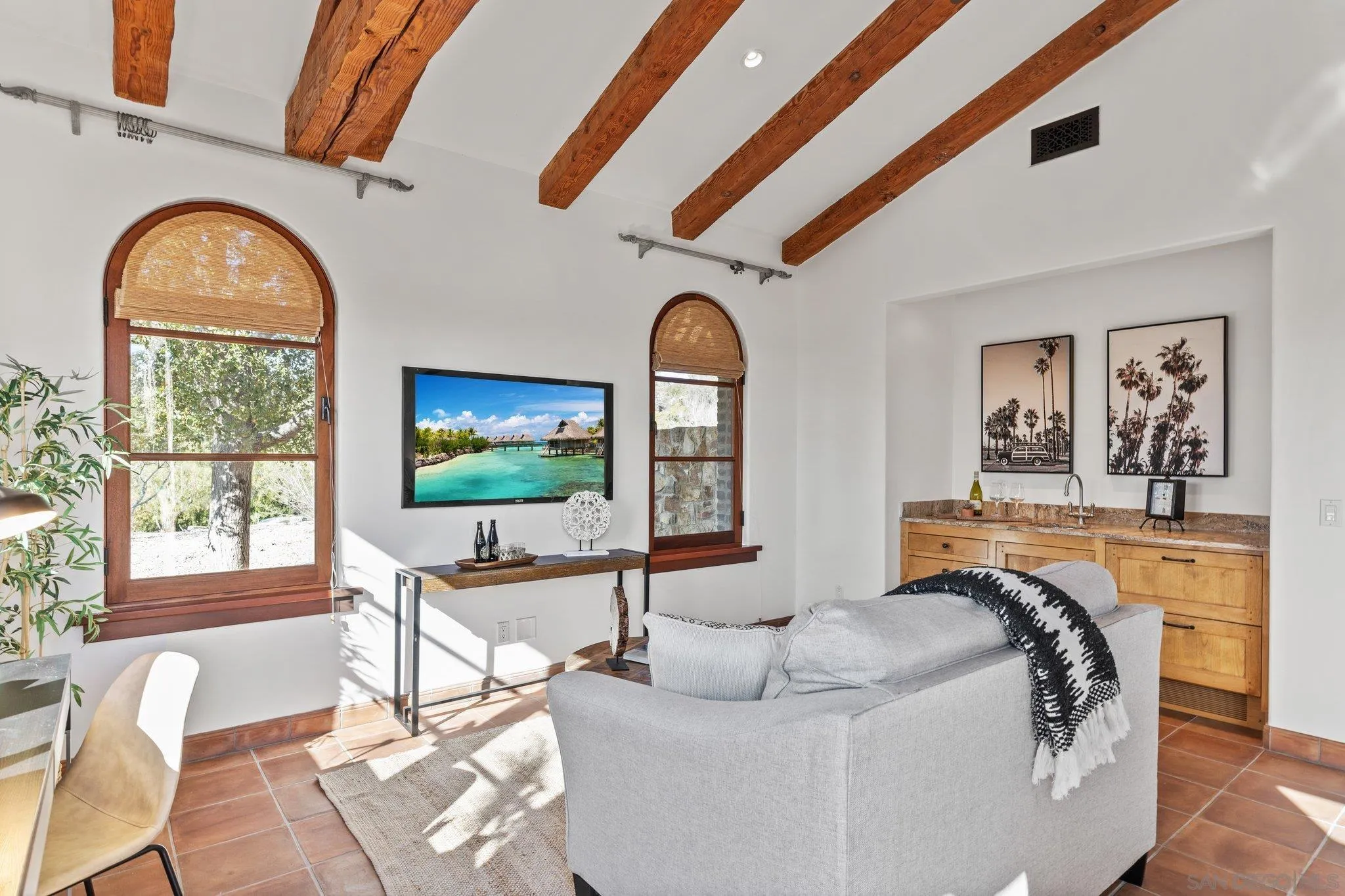 3113 Camino Del Rancho Encinitas, CA 92024 - Photo 17 of 40 a living room with fireplace furniture and a flat screen tv