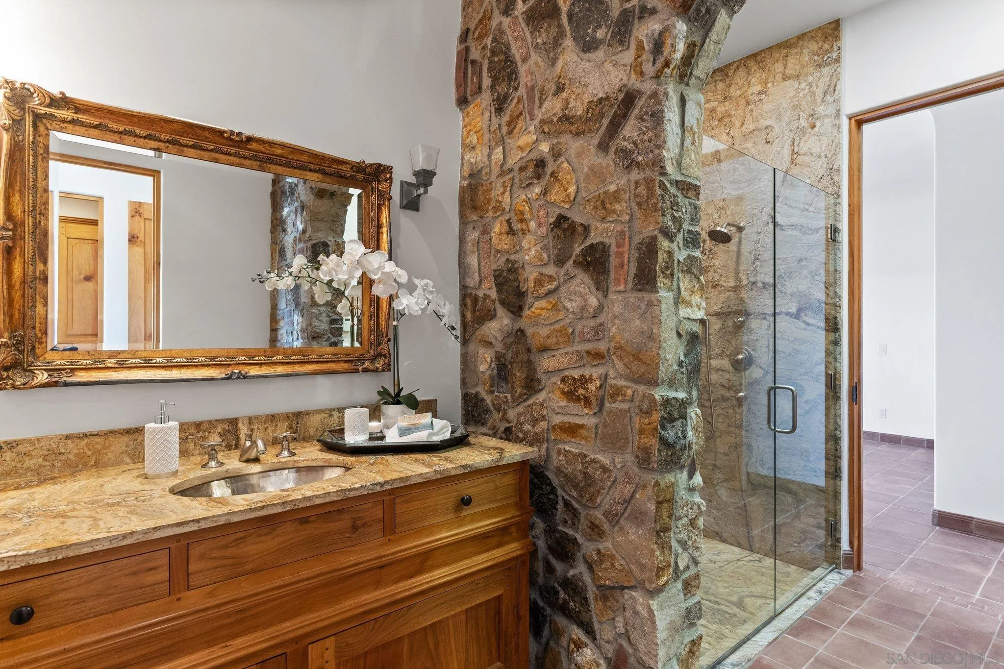 3113 Camino Del Rancho Encinitas, CA 92024 - Photo 18 of 40 a bathroom with a sink and a mirror
