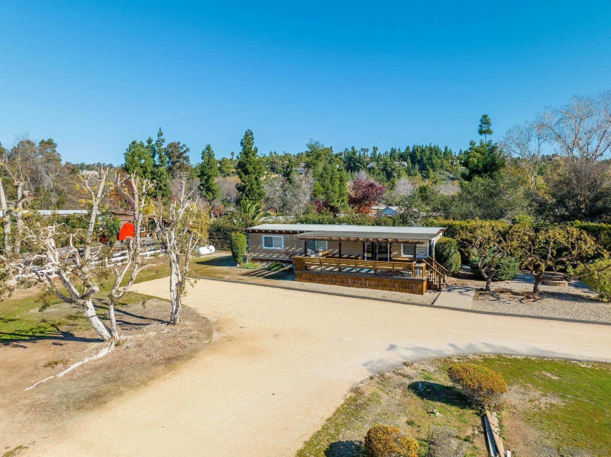 3113 Camino Del Rancho Encinitas, CA 92024 - Photo 30 of 40 a view of swimming pool with outdoor seating and trees in the background
