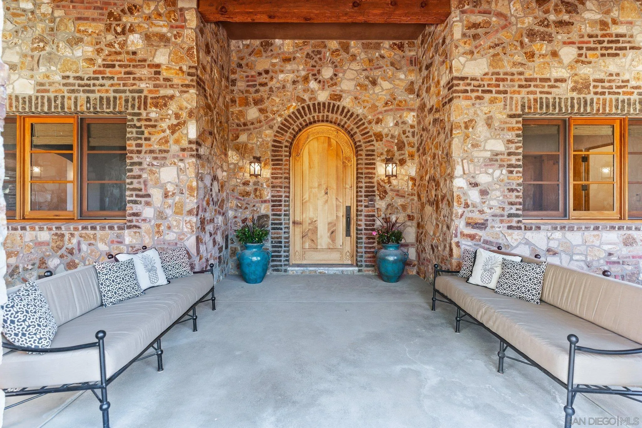 3113 Camino Del Rancho Encinitas, CA 92024 - Photo 4 of 40 a living room with furniture and a fireplace