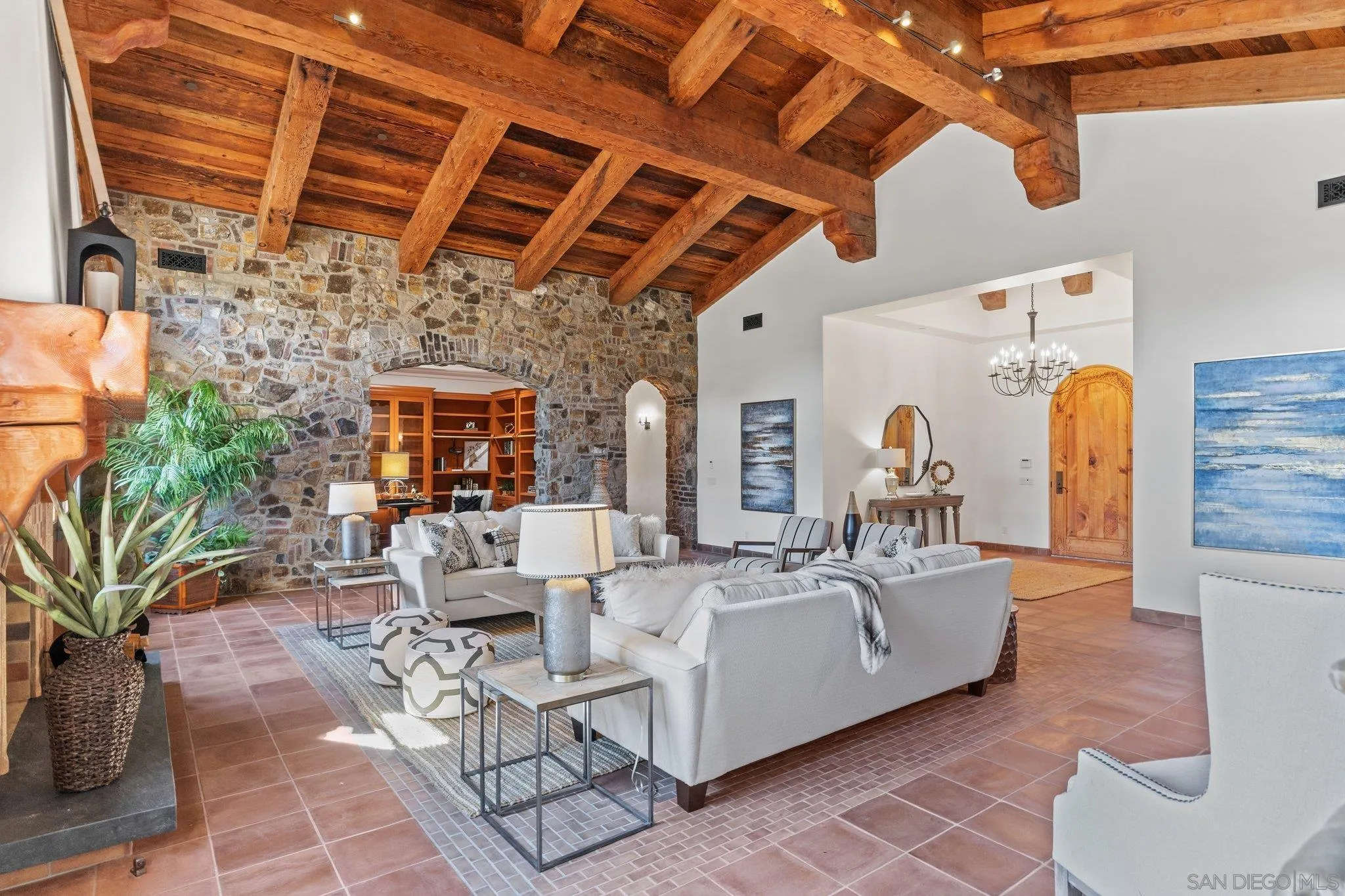 3113 Camino Del Rancho Encinitas, CA 92024 - Photo 5 of 40 a living room with furniture and a chandelier