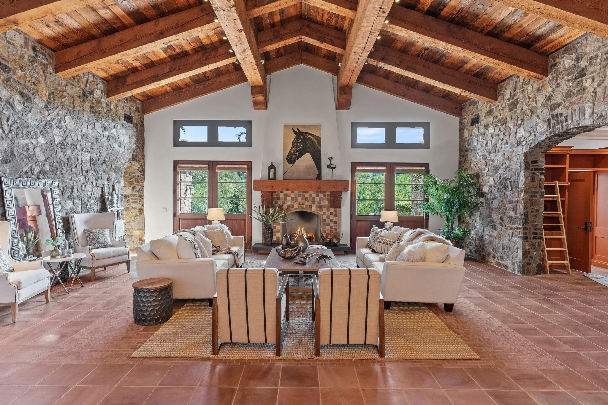 3113 Camino Del Rancho Encinitas, CA 92024 - Photo 6 of 40 a living room with fireplace furniture and a large window