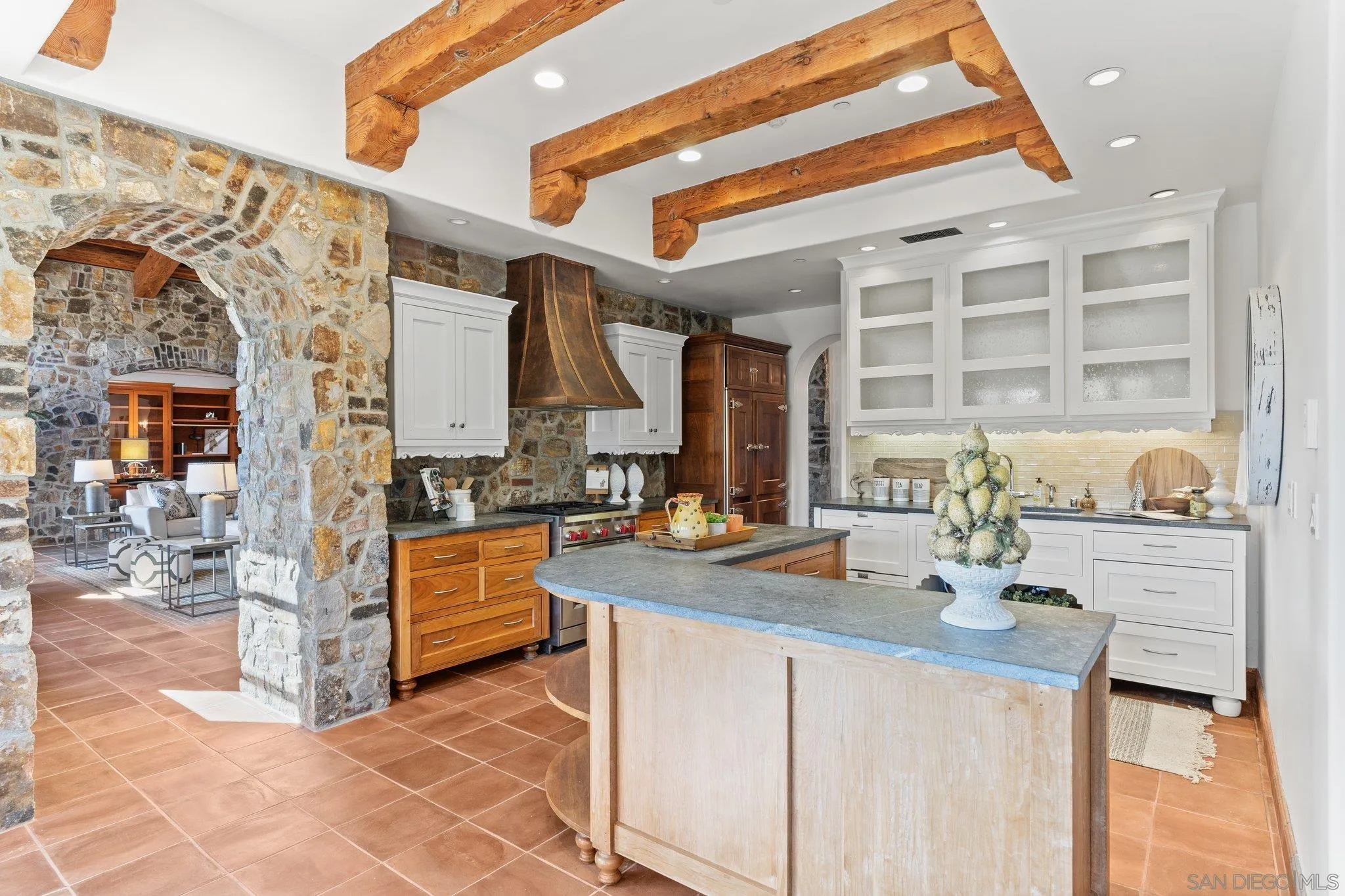 3113 Camino Del Rancho Encinitas, CA 92024 - Photo 8 of 40 a kitchen with stainless steel appliances granite countertop a stove a sink and a cabinets