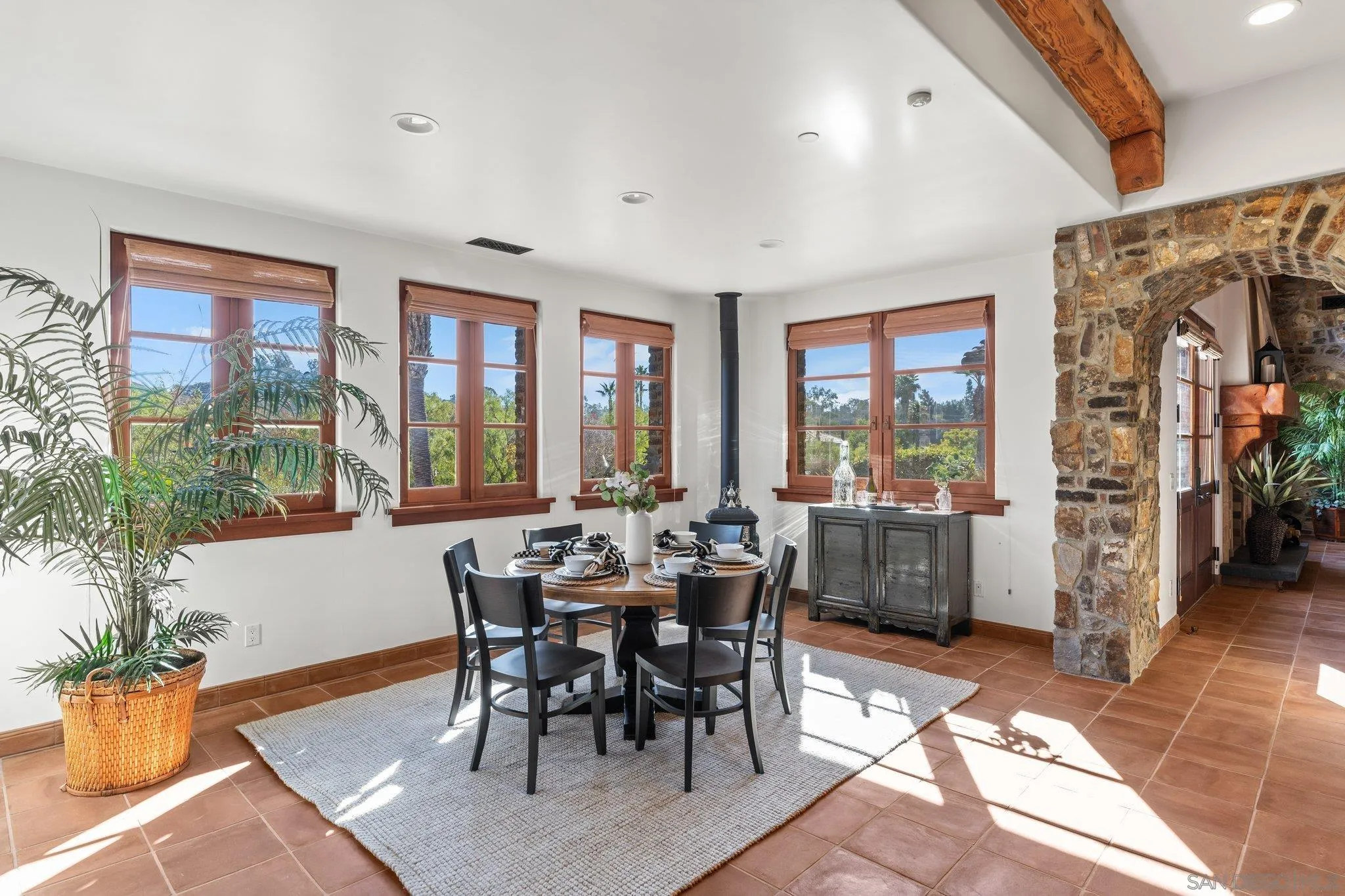 3113 Camino Del Rancho Encinitas, CA 92024 - Photo 9 of 40 a view of a dining room with furniture window and wooden floor