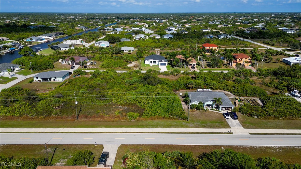 14110 Appleton Boulevard Port Charlotte, FL 33981 - Photo 7 of 19 an aerial view of residential houses with outdoor space and trees