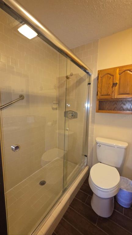 454 Cottage Circle, Unit 454 River Ranch, FL 33867 - Photo 17 of 27 a bathroom with a toilet and a shower