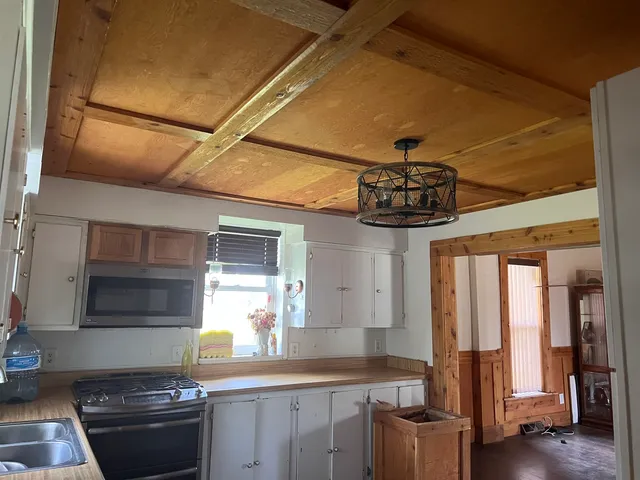 a kitchen with stainless steel appliances granite countertop a stove and a sink