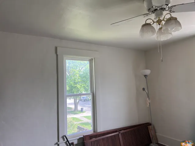 a view of hallway with windows